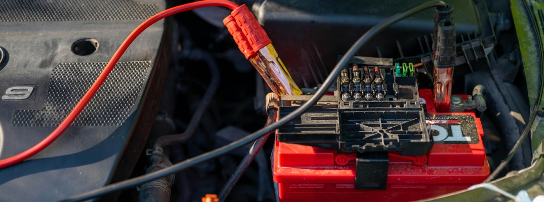 A stock photo of a car battery being charged.